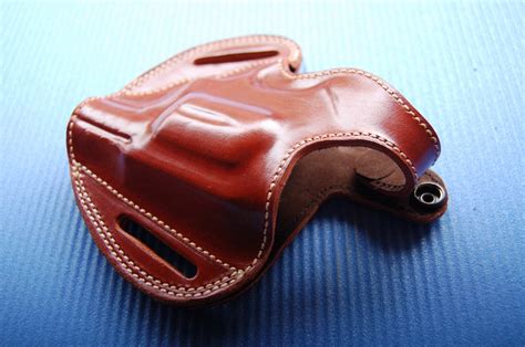 A unique hybrid OWB leather holster made for the Taurus Model 605 (M605) providing the safety and security of Kydex with the comfort and durability of premium leather. Available in Left and Right hand versions and Black or Brown leather. Free USA Shipping Today.