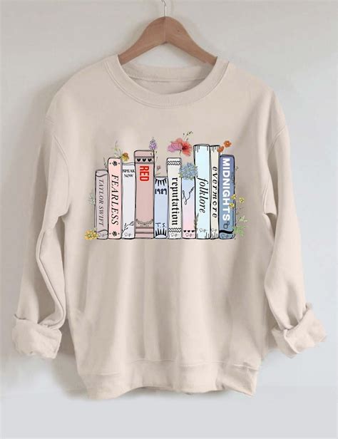 Taylor swift book sweatshirt. December 11, 2023. Taylor Swift is making news once again for attending Sunday night’s Kansas City Chiefs football game to cheer on Chief’s tight end Travis Kelce. This time, Swift was seen ... 