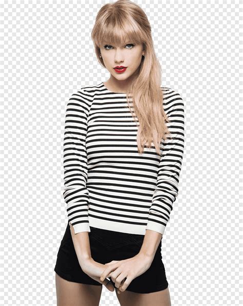First, Swift wore a form-fitting striped dress in a video describing her song "Snow on the Beach." The mini dress featured blue, yellow, and red stripes; long sleeves; and a high rounded neck. She also posted a video wearing a brown sweater with a '70s V-neck polo collar during her Midnights Mayhem series.. 