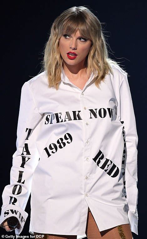 Taylor swift white button up shirt. Discover the Taylor Swift AMA White Button Up Shirt by Rockatee, inspired by her 2019 AMAs performance. A versatile satin shirt perfect for Swifties to wear at concerts, events, or as stylish casual wear. 