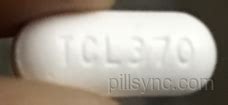 7L001 Pill - white capsule/oblong, 18mm . Pill with imprint 7L001 