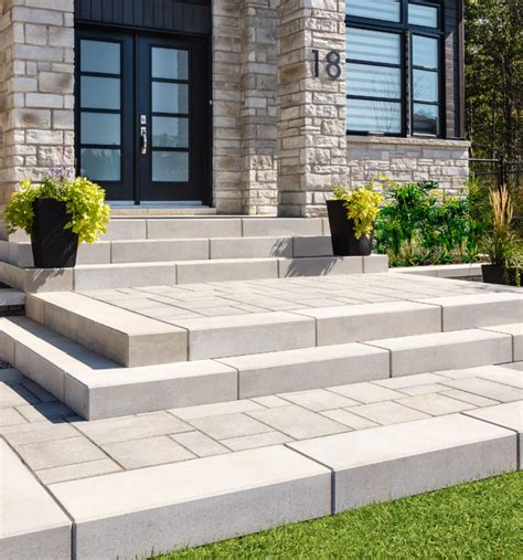 Techno bloc. In terms of style, Techo-Bloc Modern Yard block resembling rounded fieldstones can lend a cozy, rustic feel to your landscape, whereas Techo-Bloc Modern Yard block designs resembling chiseled stone complement more formal designs. Lowe’s also carries a selection of Techo-Bloc Modern Yard retaining wall caps to give your wall a more finished look. 