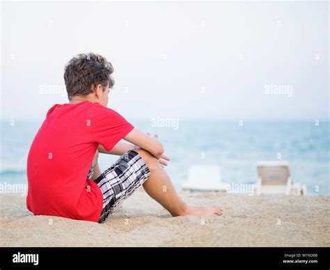 th?q=Teen alone on beach