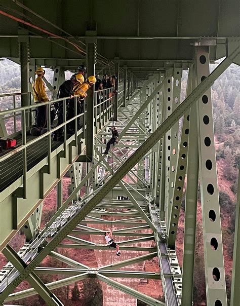 Teen rescued after stunt mishap leaves him dangling from California’s tallest bridge