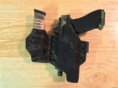 Teir one holsters. Our OPTIO holster offers fully adjustable retention while still maintaining toughness and durability. The OPTIO also has casing ports in the bottom of the holster which allow spent casings to fall through. This ensures that the firearm stays fully protected and doesn't allow casings to get stuck and cause issues while re-holstering. 