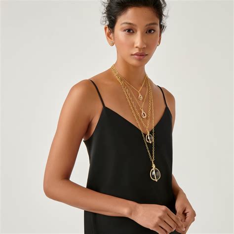 Temple st clair. Learn more. The elegant and versatile 18K Large Ball Chain is the perfect home for angels, amulets, and other small pendants. Finished with our Temple charm, our 18K Ball Chain is available in two adjustable lengths. The 16" and our 18”. Product Details 18K gold Length: 22", Links: 3mm Imported. 