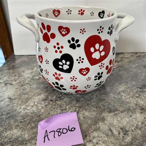 Temptations pawfetti. This 18 oz cereal bowl from Temp-tations is perfect for any pet lover. The handpainted design features adorable cat paws or dog paws with a fun Pawfetti pattern. The round bowl is made of durable stoneware and … 