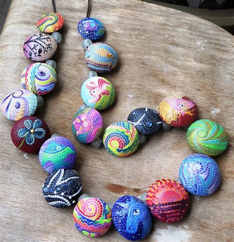 Discover a Collection of flower clay bead at T