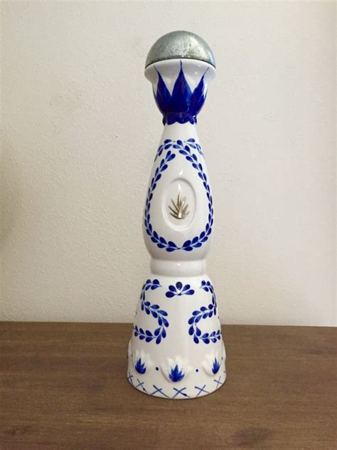 Tequila blue and white bottle. Patrón Tequila is known for producing premium tequila made from 100% Blue Weber agave. Each bottle of Patrón undergoes a handcrafted process where the brand claims at least 60 people are ... 