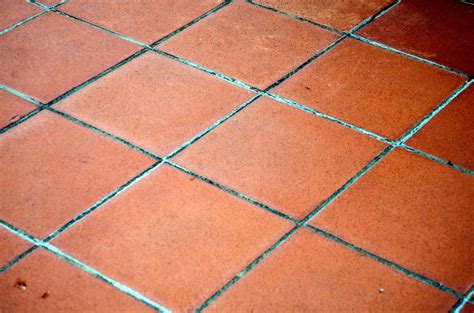 Terracotta tiles floor. Most of our terracotta tiles will range in price from approximately $6.00 to $12.00 per square foot for field tile. Field tiles are the bulk of the tiles used in a flooring area. Please browse Stone Tile Depot for more concise pricing. 