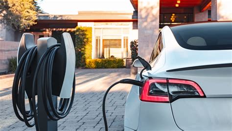 Tesla charging at home. The charge port is located on the left side of Model Y, behind a door that is part of the rear tail light assembly.Park Model Y to ensure that the charge cable easily reaches the charge port.. With Model Y in Park, press and release the button on the Tesla charge cable to open the charge port door.. You can also open the charge port door using any of these methods: 