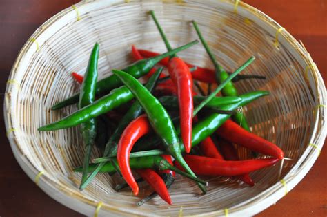 Thai chillies. For the Thai Roasted Chili Fried Rice with Prawns: Cook the prawns: Heat one tablespoon of canola oil in a large nonstick wok. Once hot, add the prawns and cook undisturbed for about a minute. Turn the pieces over and cook for another 30 seconds, then stir-fry for 10-20 seconds. 