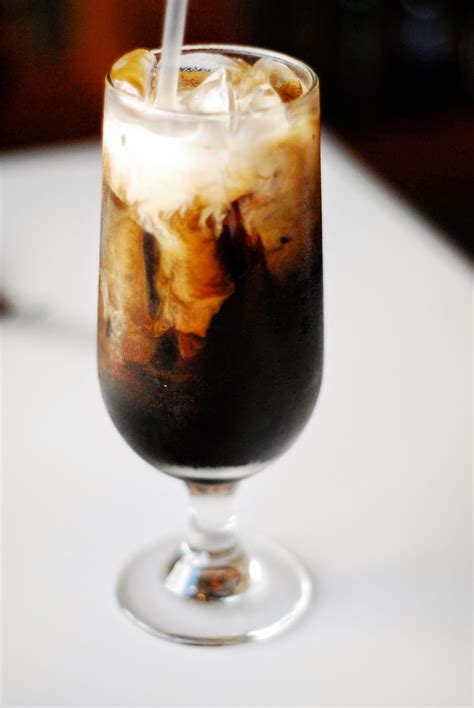 Thai coffee. Thai iced coffee is very popular with Thais and foreigners alike and is known in Thai as Oliang or Oleang.Oliang is a blend of coffee and other ingredients. Pantainorasingh brand is 50% coffee, 25% corn, 20% soya bean, 5% sesame seed.. Traditionally, oliang is brewed with a tung dtom kaffee, a tea/coffee sock with a metal ring and a handle to which a … 