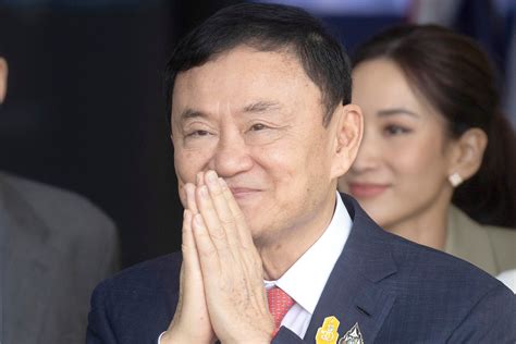 Thailand’s king reduces former Prime Minister Thaksin’s 8-year prison term to a single year