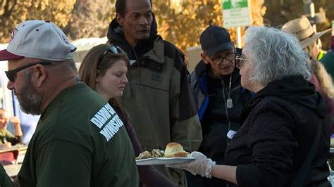 Thanksgiving outreach brings homeless people together at Denver City Hall