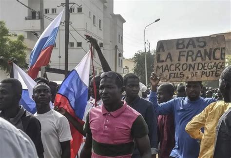 The French embassy in Niger is attacked as protesters waving Russian flags march through the capital