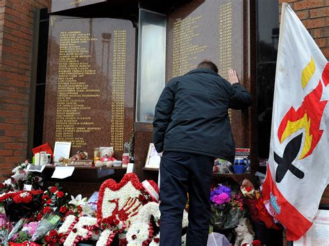 The UK apologizes to families of 97 Liverpool soccer fans killed after a stadium crush 34 years ago