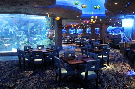 The aquarium restaurant. Specialties: Dive into food and fun at the Aquarium Restaurant, located at the Kemah Boardwalk. Your underwater adventure begins as you are seated around a 50,000-gallon aquarium tank, home to a wide variety of fish, sharks, stingrays and more. Make a splash with deliciously fresh seafood, steak, chicken and decadent desserts all served in an … 