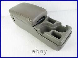 The cup holder in the 1998 Buick Century console broke. - Fixya