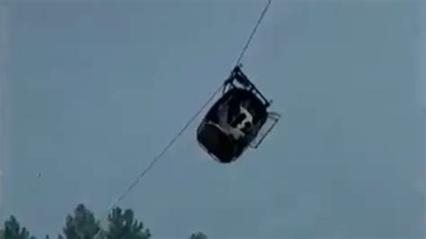 The first 2 children are rescued from a cable car dangling hundreds of feet in the air in Pakistan