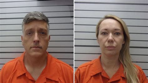 The owners of a funeral home where 190 sets of human remains were ‘improperly stored’ have been arrested