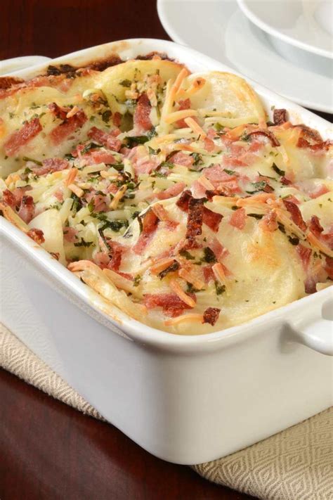 The pioneer woman scalloped potatoes and ham. Apr 30, 2024 · Gradually add milk; bring to a boil. Cook and stir 2 minutes. In a large bowl, combine potatoes, ham and onion; place half of the mixture in a greased 2-1/2-qt. baking dish. Top with half of the sauce; repeat layers. Cover and bake until potatoes are almost tender, 65-75 minutes. 