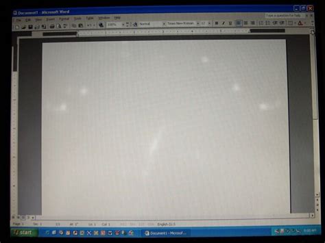 The screen appears to have a cloudy, white shadow or bright …