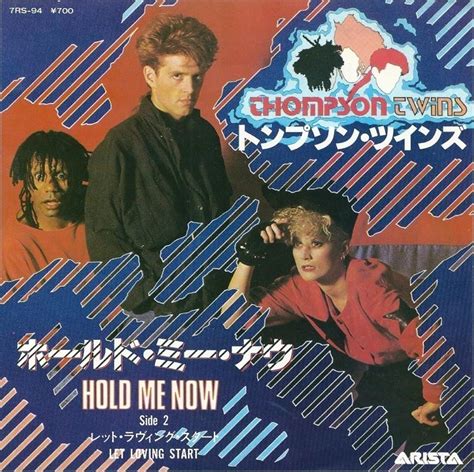 Thompson twins hold me now. "Hold Me Now" by Thompson TwinsYear: 1983Album: Into The GapLyrics:I have a picturePinned to my wallAn image of you and of me and we're laughing, we're lovin... 