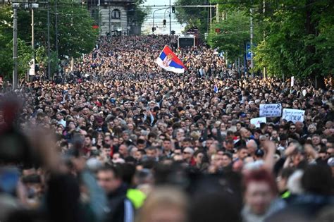 Thousands march in silence in Serbia after mass shootings