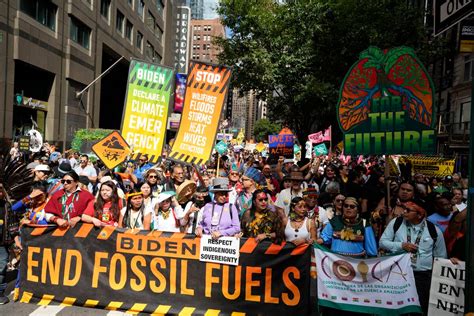 Thousands march to kick off climate summit, demanding an end to warming-causing fossil fuels