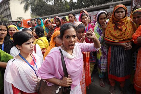 Thousands of Bangladesh’s garment factory workers protest demanding better wages