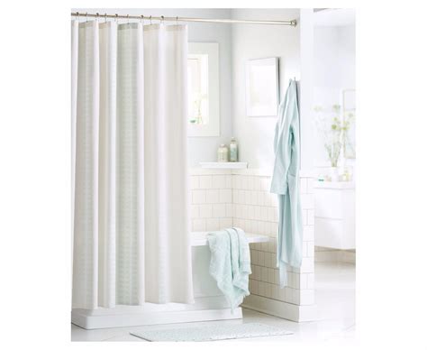 Threshold shower curtain. This Threshold shower curtain is of similar quality to previous versions. The material is cotton poly and feels similar to a table cloth. It's thickness is appropriate for a shower curtain. The color is a bit of a faded blue which could go with a lot of themes. It is machine washable and generally a great option if it fits your style. 