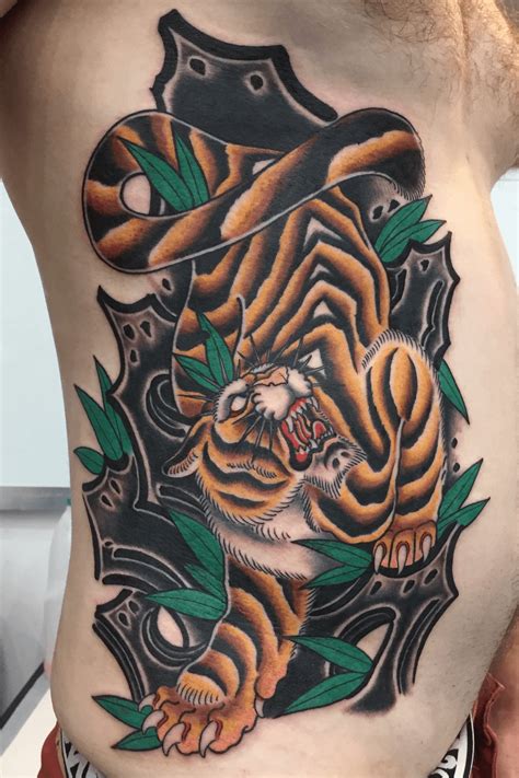 Tiger tattoo, rib tattoo, black and white. By Luke Wessman at the