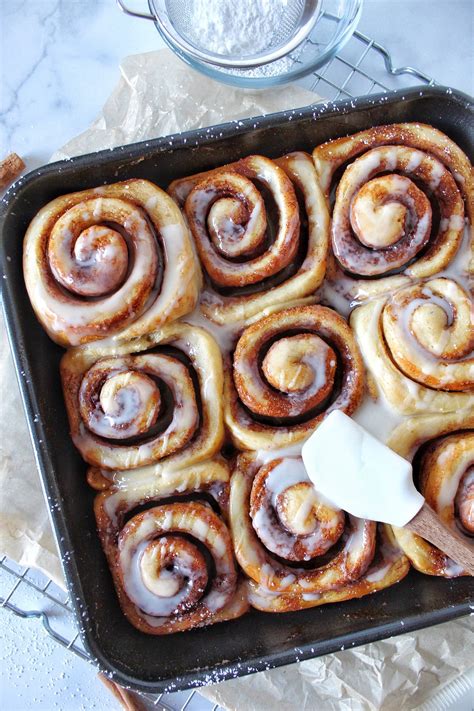 Tik tok cinnamon rolls. Place cinnamon rolls in a greased casserole dish. Pour heavy whipping cream over the top of each cinnamon roll. In a saucepan, melt butter and brown sugar together. Add pecans. Pour brown sugar … 