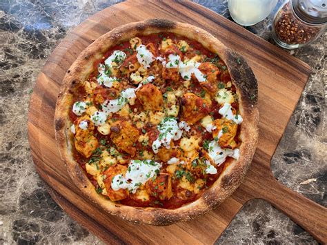 Tikka masala pizza. Pizza History - Pizza history can be traced as far back as ancient Greece when flat bread was dressed with spices and oils. Learn more about pizza history. Advertisement Italians a... 