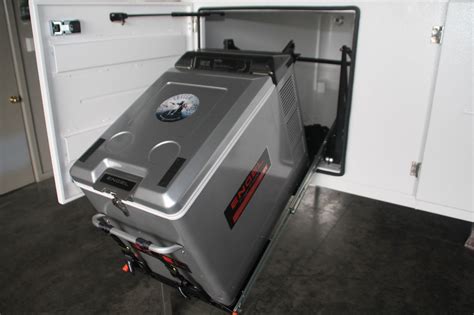 The Tilt Combo 1 Slide is designed for portable fridges up to 50 Litres, such as Bushman, Waeco, Engel and ARB 35 & 47 Litre. Exclusive to RV Storage Solutions, the NEW Tilt Slide Combo is the fridge access system everyone has been looking for.