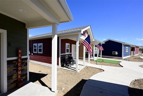 Tiny home village for vets welcomes first residents