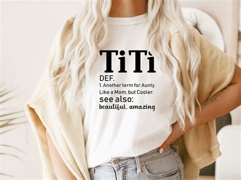 Solid colors: 100% Cotton; Heather Grey: 90% Cotton, 10% Polyester; All Other Heathers: 50% Cotton, 50% Polyester ; Imported ; Machine Wash ; Grab this cute and awesome present is the better way for Girls and boys to show their love for aunty By Wearing This Cute saying Titi Definition outfit For your aunt, for auntie birthday featuring the phrase Titi Definition.. 