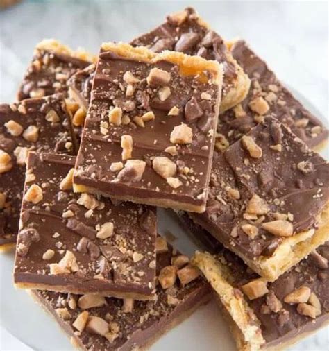 Toffee candy bar. Aug 3, 2016 · Instructions. Pre-heat your oven to 350 degrees. Line a baking sheet with parchment paper or silicon baking mat and arrange your graham crackers on a single layer covering the entire baking sheet. In a small pot, melt your butter over medium heat. Once butter is melted, add in the brown sugar. 