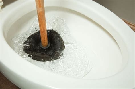 Toilet plunger not working. Let it sit about 10 minutes. Dump in a second container of hot soapy water – if it will fit. Let it sit for a few minutes and plunge if you have a plunger. Don’t flush yet! Quickly pour in about a gallon of water instead of trying to flush the toilet. If it’s unclogged the toilet will manually flush without refilling. 