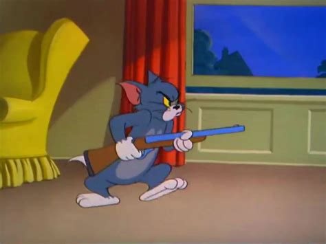 In this meme, two cats from the childrens' cartoon "Tom and Jerry", Tom (a grey cat) and Butch (a black cat), engage in a gun fight. They are both holding blue weapons. With Butch's back turned to him, Tom aims his …. 