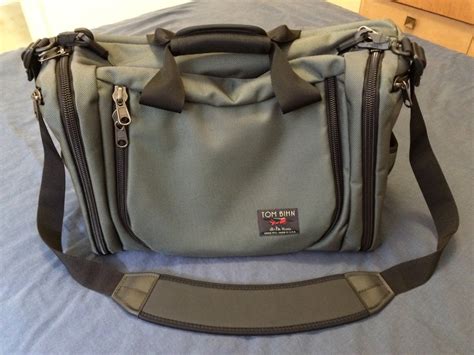 Tom bihn bags. Large Travel Tray. $27.00. Svelte sacoche design of shoulder bag that unfolds to hold more. A single pocket with a couple of organizational slots perfect for phones, keys a wallet, and a pen or stylus. Designed and sewn in Seattle, U.S.A. with globally sourced materials from Japan, Korea, Taiwan, and U.S.A. 