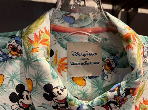 Minnie Mouse. Take a tropical vacation with Mickey and his friends when you're out and about in this woven shirt by Tommy Bahama. Minnie and Donald join Mickey in the allover print with its lush and colorful floral pattern. Both casual and smart, the short sleeve shirt features a lightweight fabric that's perfect for those warm summer days. . 