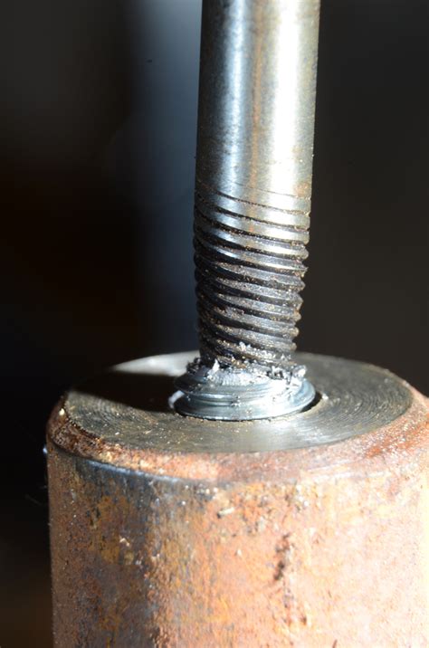 1. Insert the tap extractor into the flutes of the broken tap. 2. Push the holder piece downward so that it touches the broken tap. 3. Slide the sleeve down until it touches the workpiece. 4. Use a tap wrench to twist the end of the holder forward and backward to loosen and remove the broken tap.. 