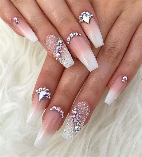 Top style nails. The elongated almond tips of this gorgeous manicure are elegant and on point for prom. 5. Pretty Crystals and Glitter Prom Nails. Source: nailstudiobytom – instagram.com. Make a statement this prom season with this beautiful crystal glitter manicure. The pink coffin nails are subtle, yet elegant for the big night. 