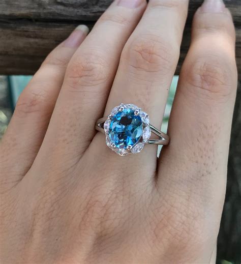 Topaz engagement ring. Vintage hexagon cut blue sapphire engagement ring white gold leaf five stone London blue topaz ring women twig nature inspired wedding ring. (7.2k) $319.20. $399.00 (20% off) FREE shipping. Add to Favorites. 