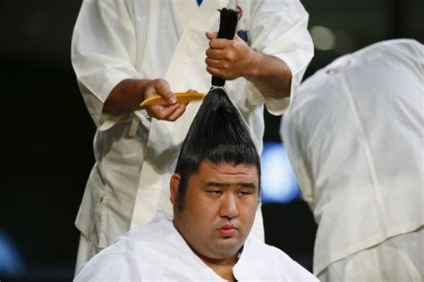 Topknot hairstyle in sumo wrestling signifies top-notch athlete in …