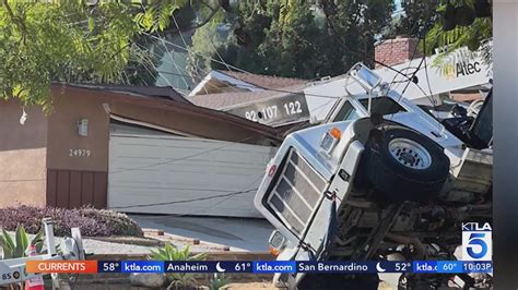 Toppled crane crushes portion of family's home