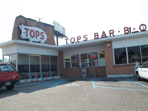 Tops bbq memphis. 1/2 or full slab of smoked, seasoned, St Louis ribs served with Tops original BBQ sauce on the side. $19.99+. Tops Famous Bar-B-Q Beans. Tops original recipe with smoked, pork shoulder in various sizes. $4.99+. Tops Original Slaw. Made fresh daily with Tops original slaw dressing in various sizes. $4.99+. 
