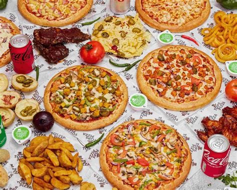 Tops pizza. BBQ Chicken Wings. £7.99. Garlic Bread with Cheese. £5.99. Meat Lover Pizza. £15.99. Fiery Wings in Hot and Spicy Coating. 
